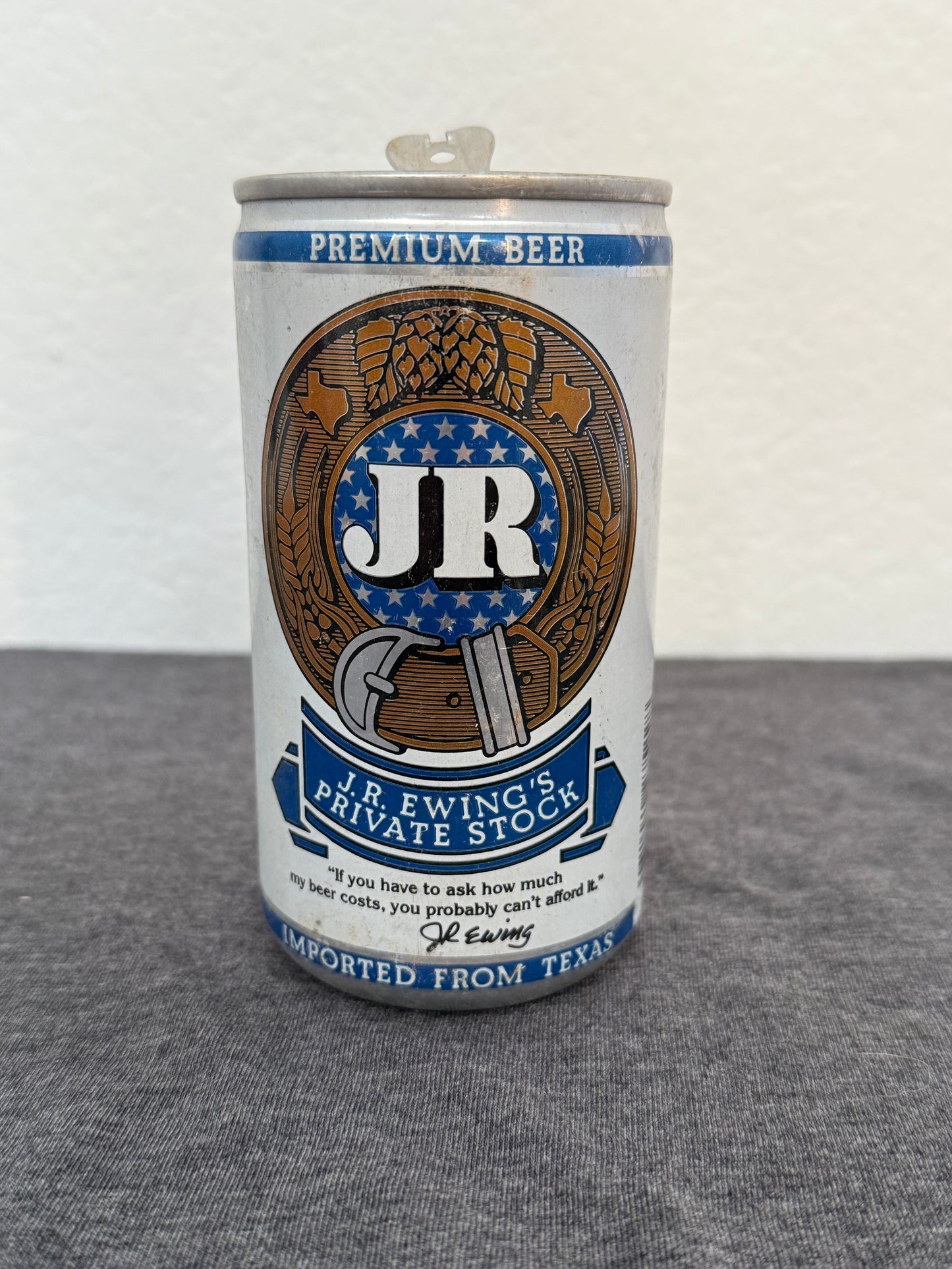 Beer can with a logo on a white and gray background