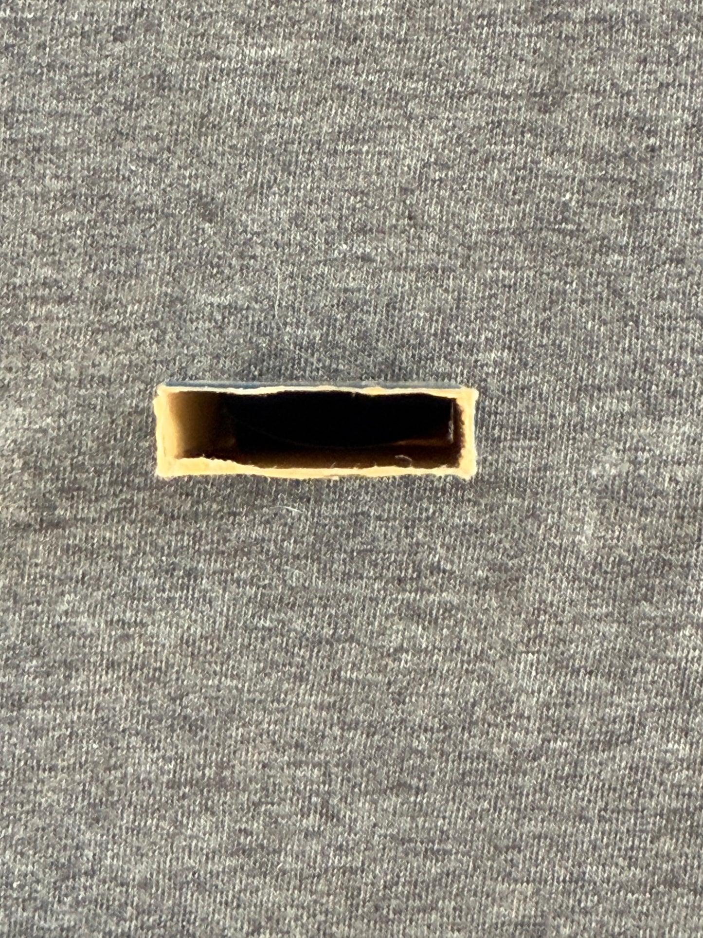 Rectangular box on a textured gray background