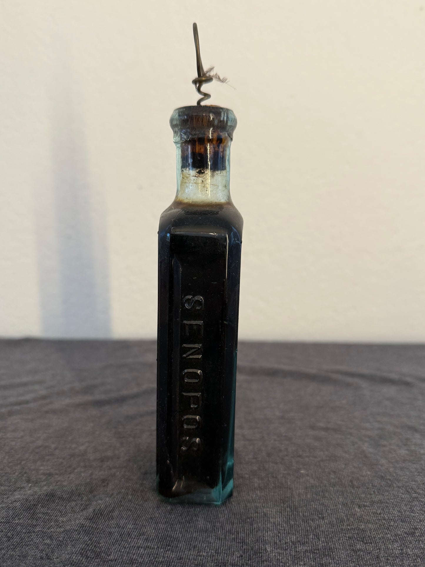 Vintage bottle with cork on a light background