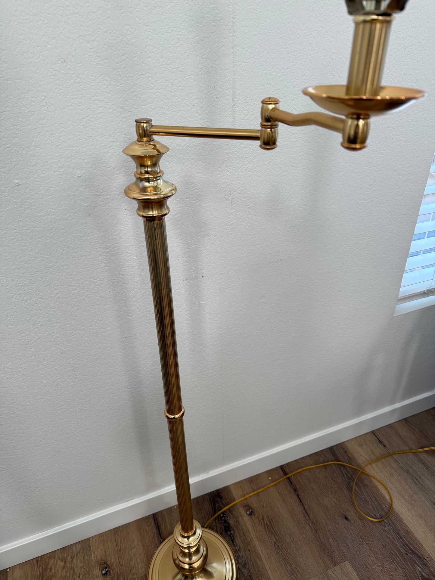 Close-up of a gold lamp with a white background