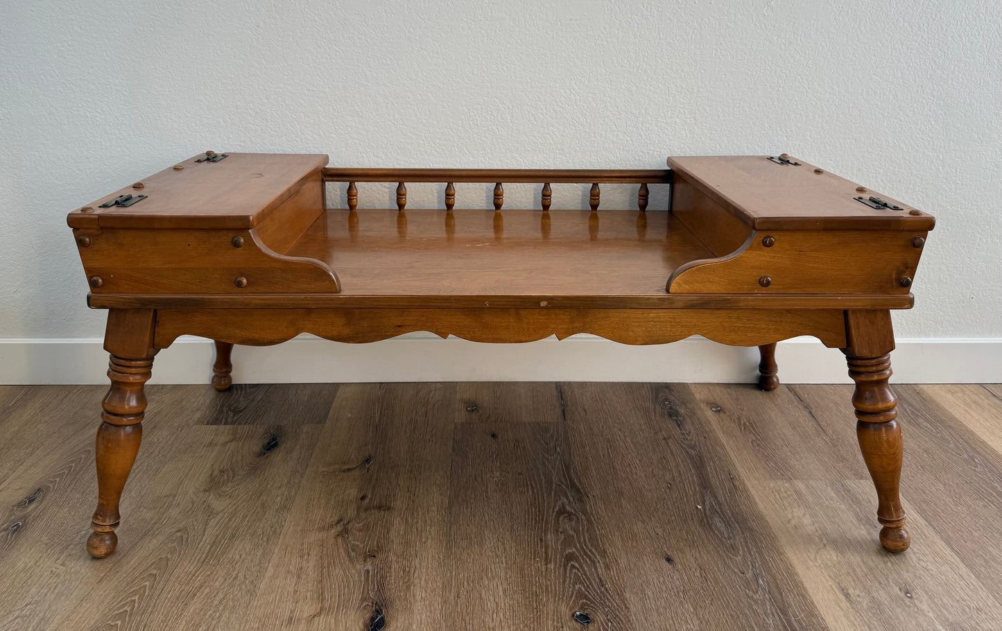 Wooden coffee table against a plain wall