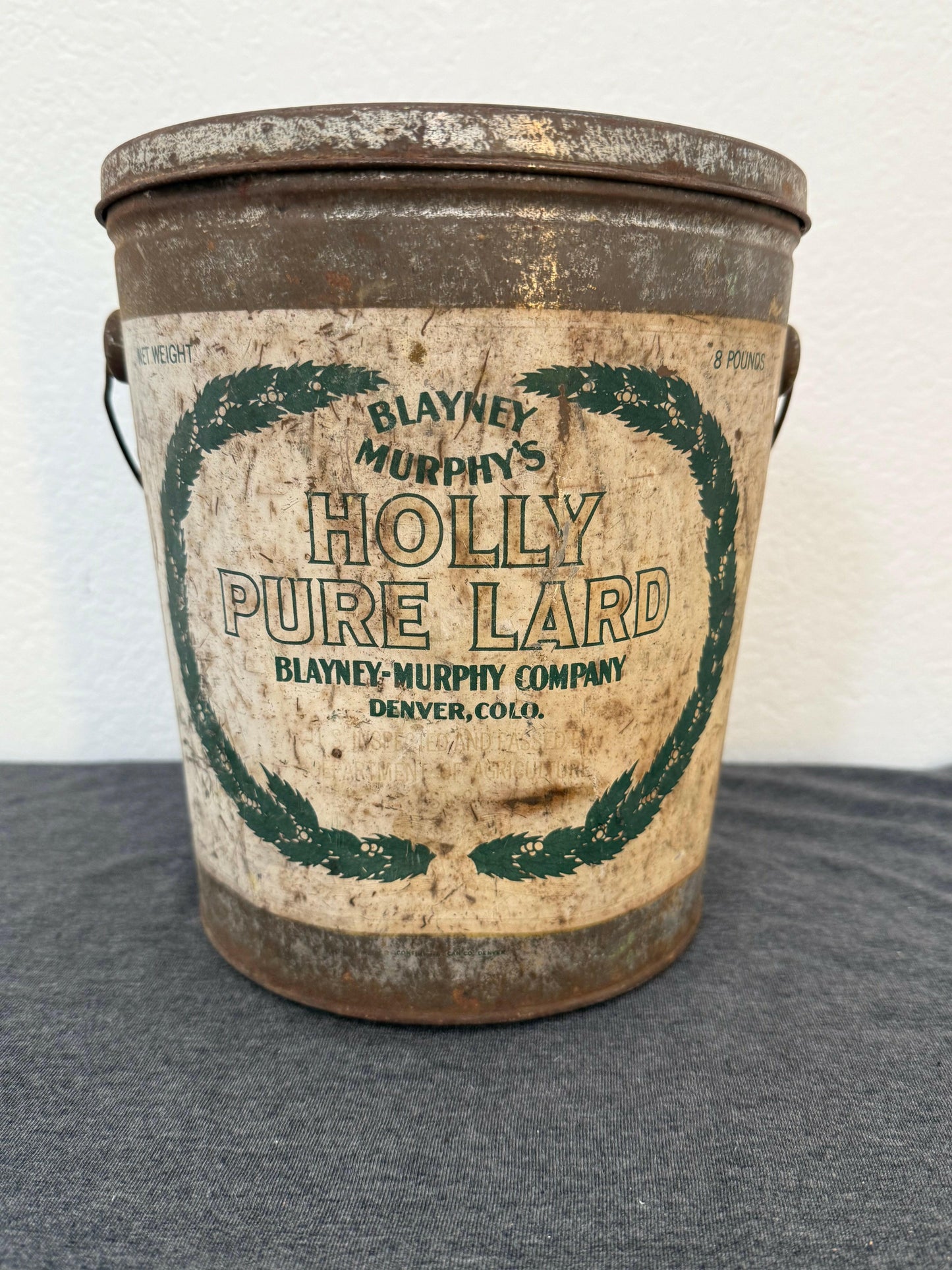 Vintage-style canister with 'Holly Pure Lard' branding on a gray background