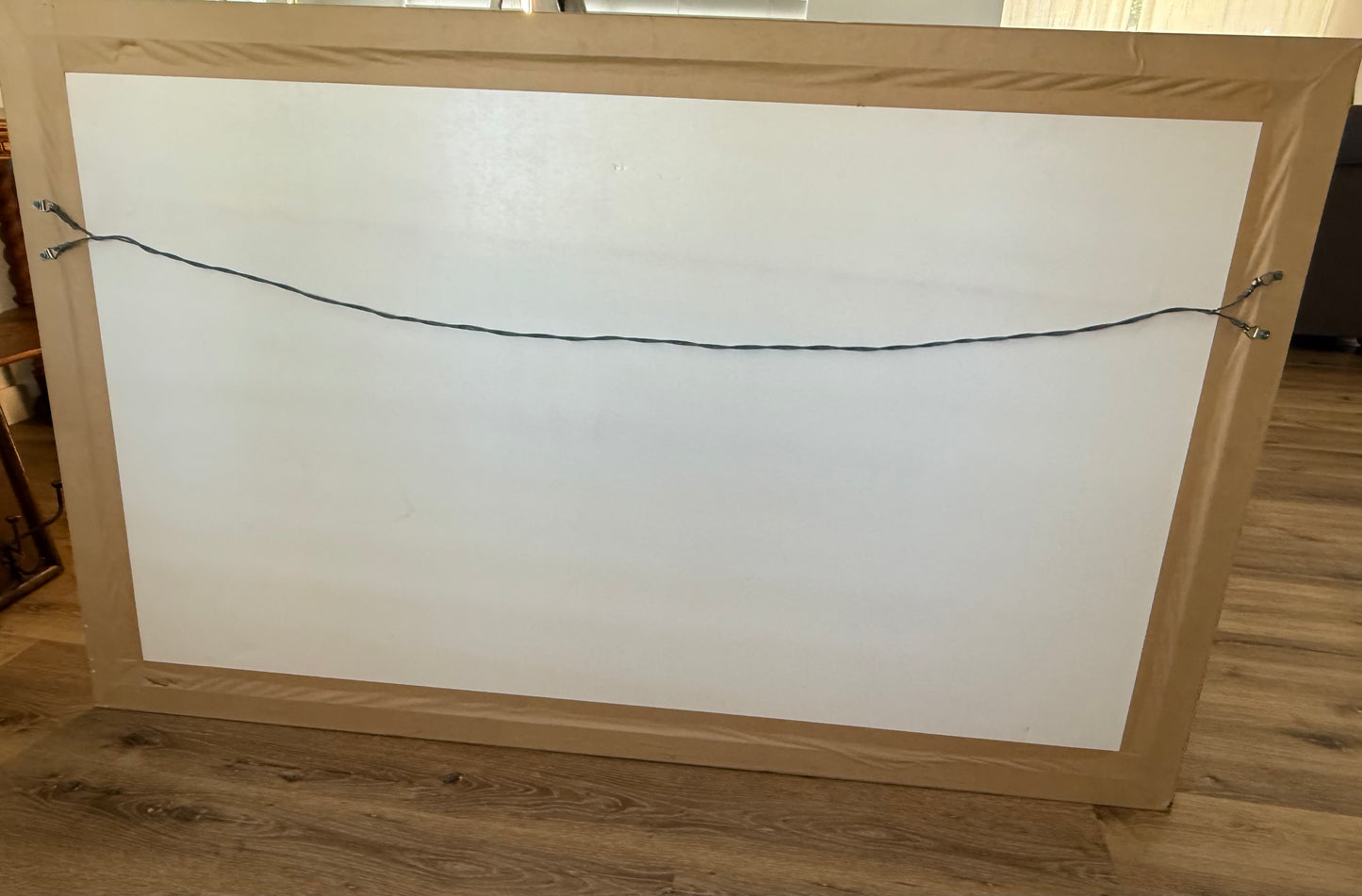 backside of wooden frame on a wooden floor