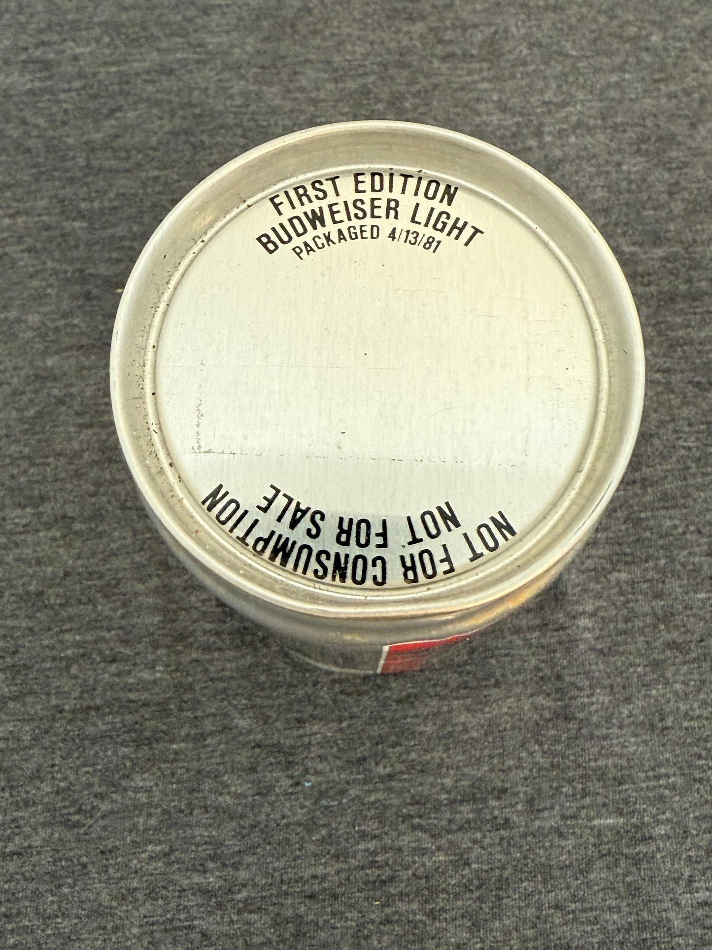 Budweiser beer bottle cap with text on a gray background