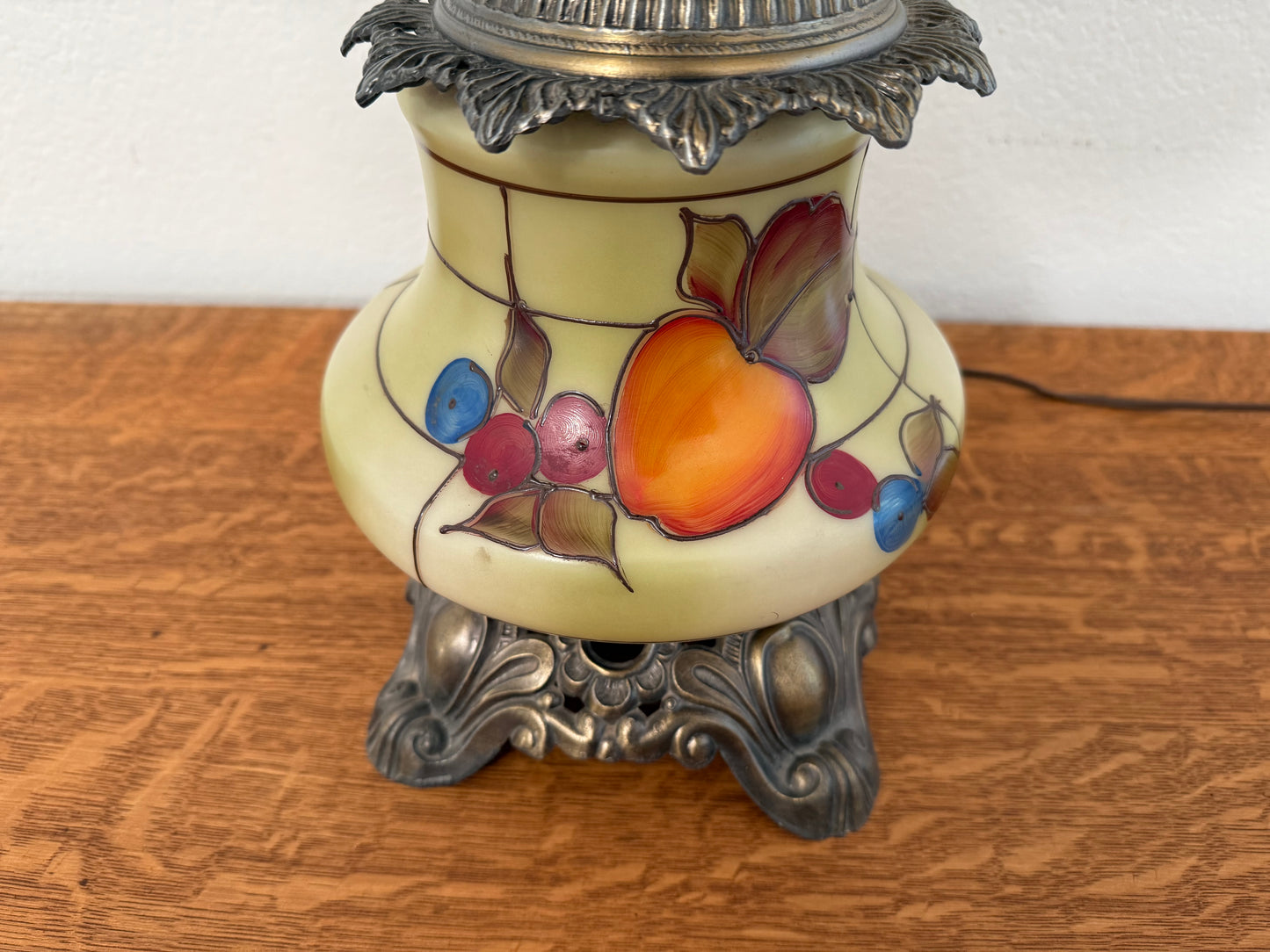 Decorative lamp with fruit design on a wooden surface
