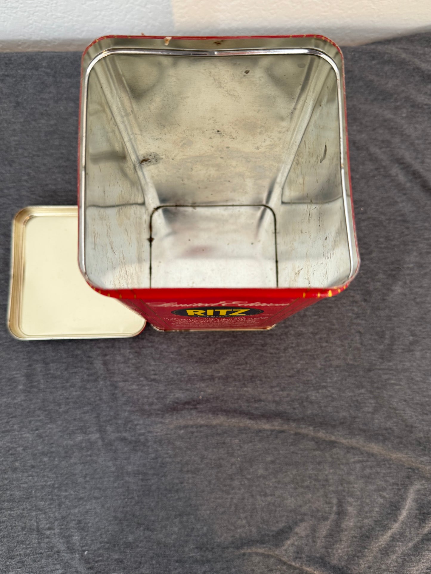 Metallic object with a reflective surface on a gray background