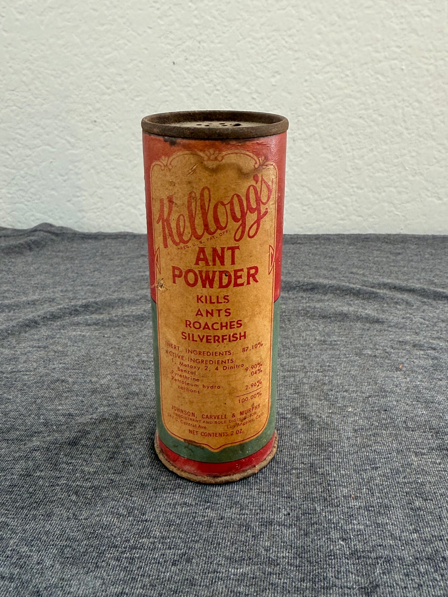 Vintage Kellogg's Ant Powder can on a gray and white background