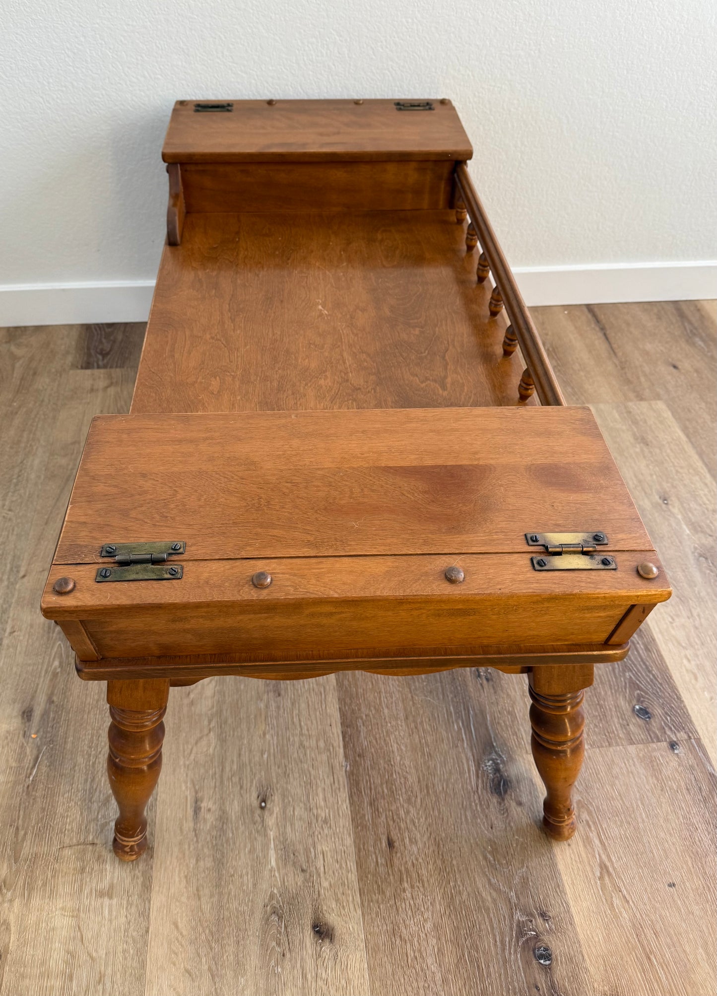 Wooden coffee table with two doors on a wooden floor