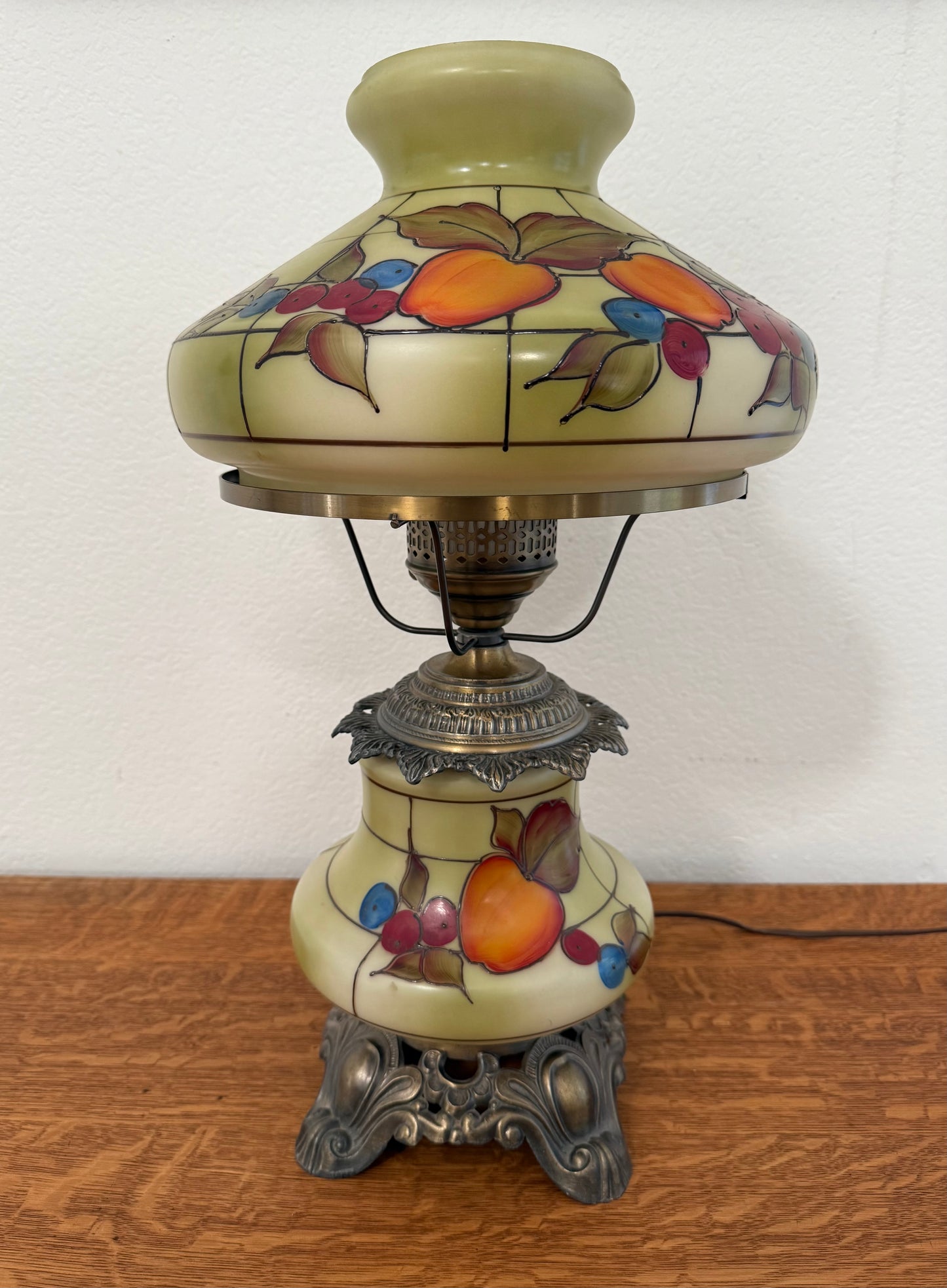 Decorative lamp with fruit design on a wooden surface