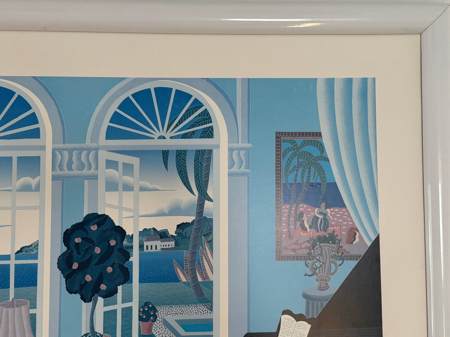 Framed artwork of a room with large windows and decorative elements.