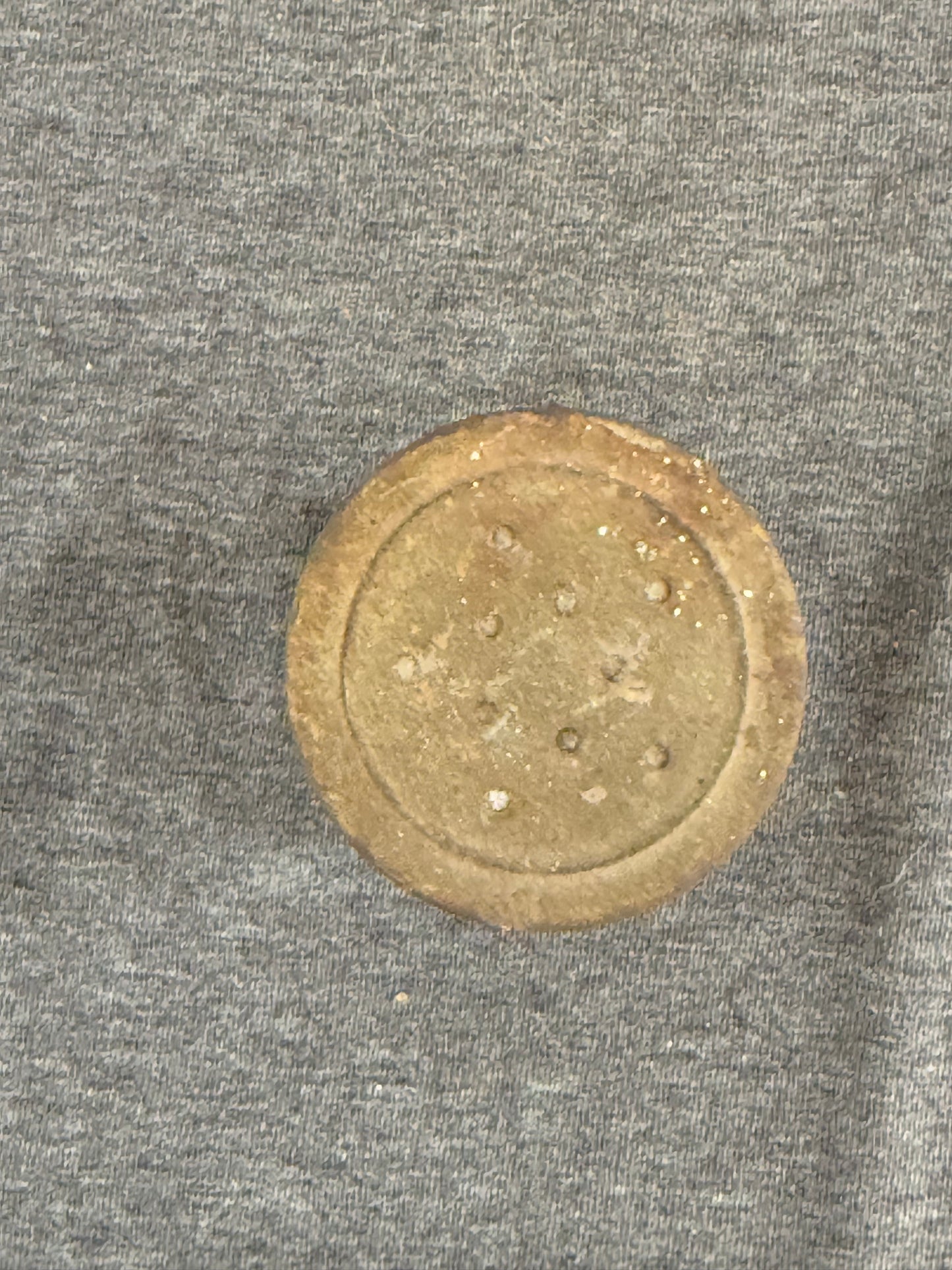 Round shaker top on a gray fabric background