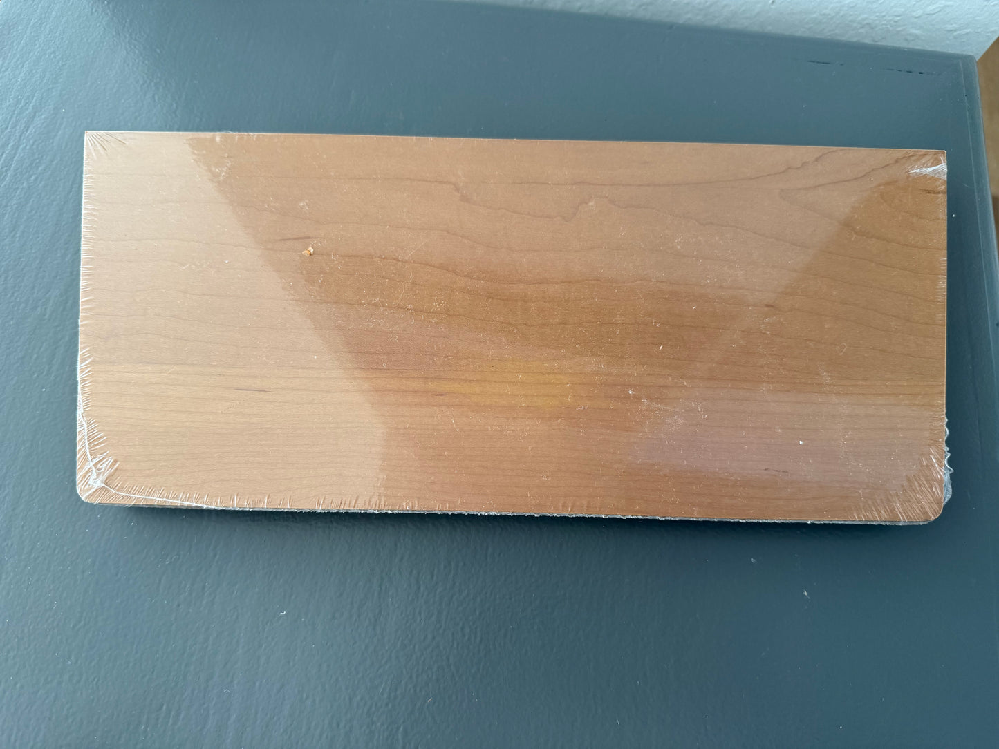 Wooden block on a dark gray surface