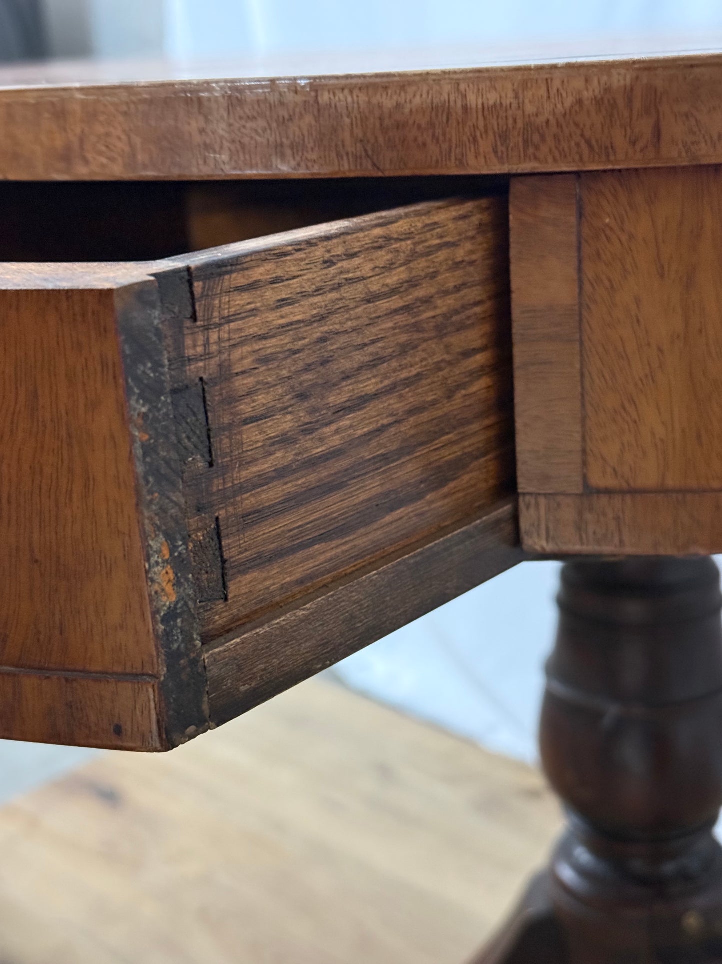 Close-up of a wooden drawer with a blurred background