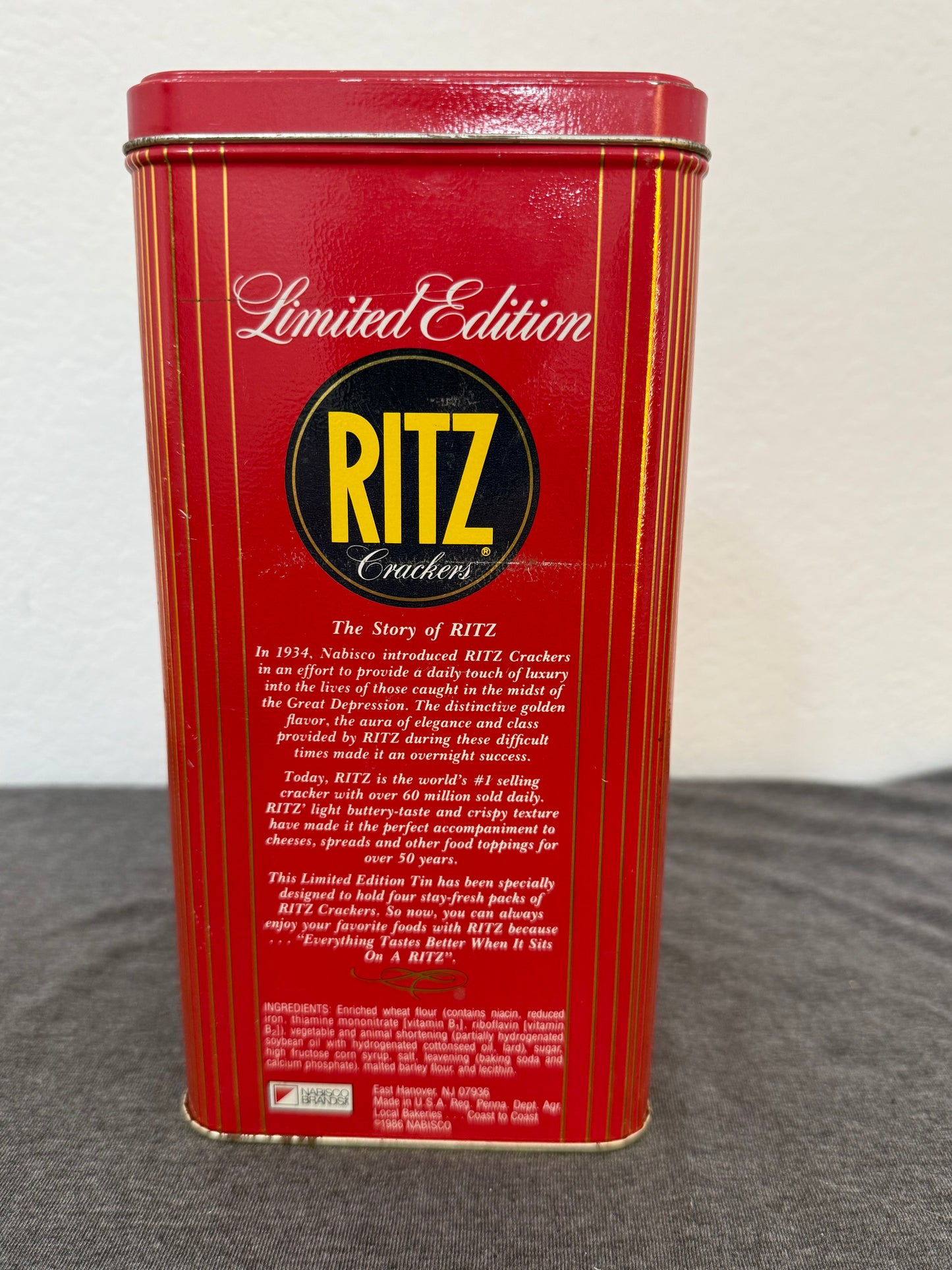 Red Ritz cracker tin on a gray surface