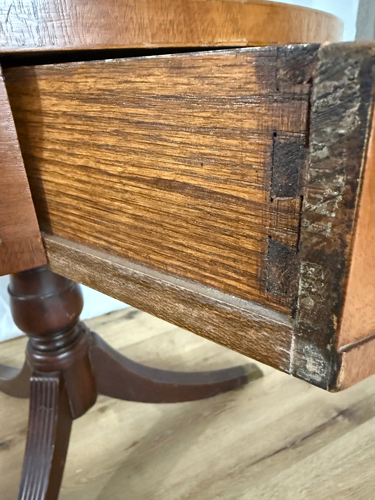 Close-up of a wooden drawer with visible grain and texture.
