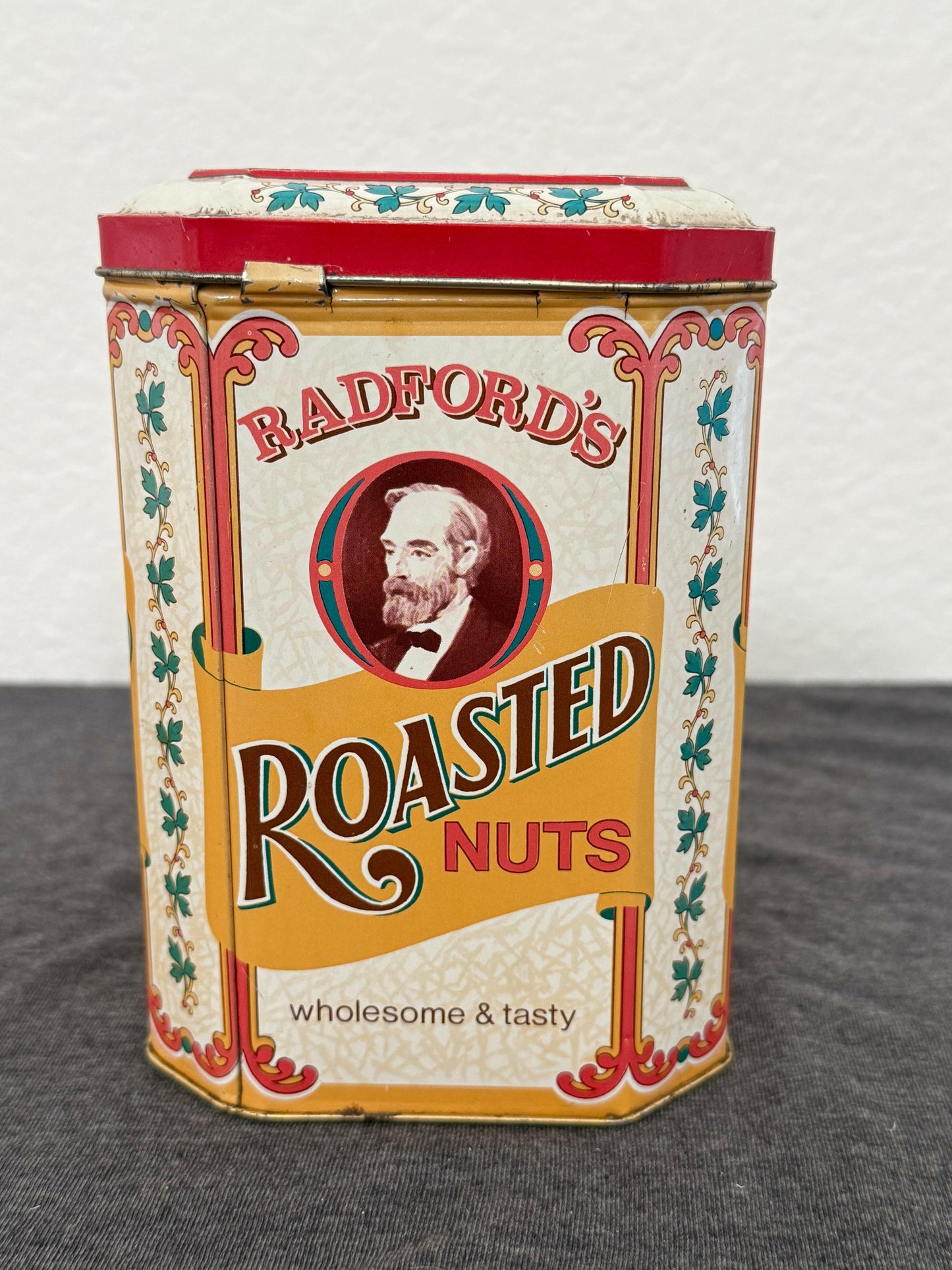 Vintage-style packaging of Bradford's Roasted Nuts on a neutral background