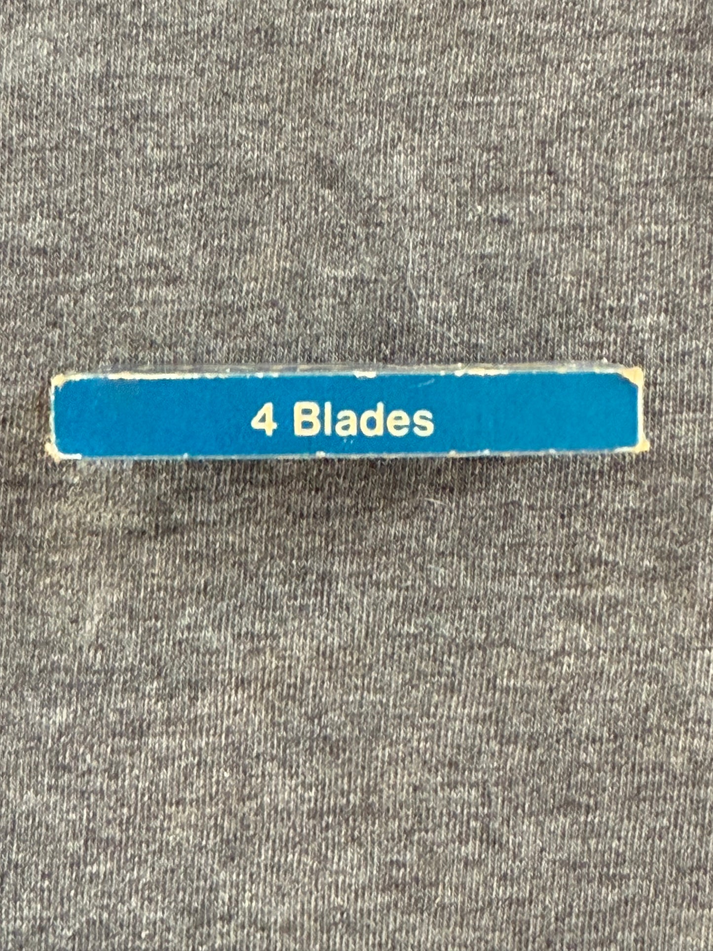 Blue strip with '4 Blades' text on a gray textured background