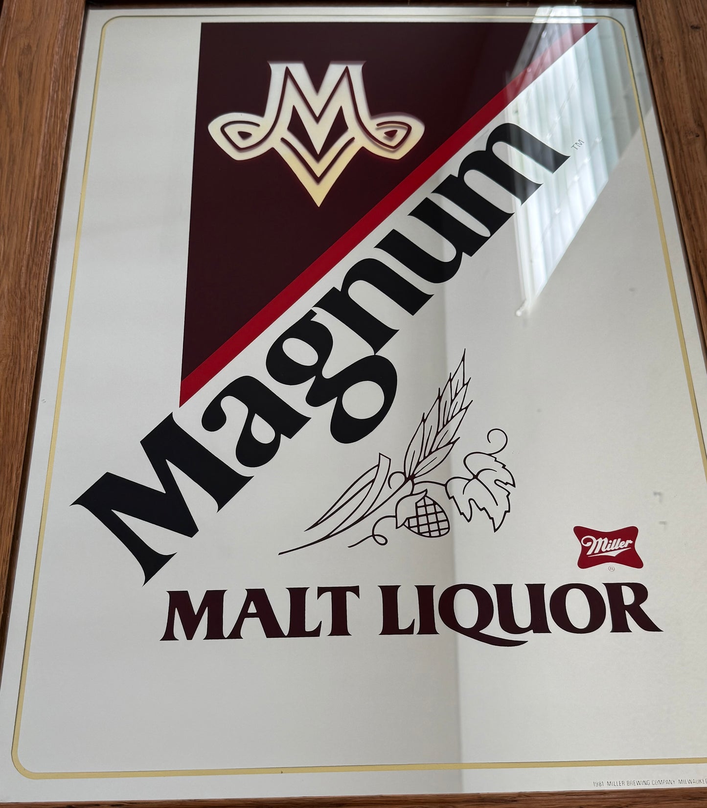 Magnum Malt Liquor sign with brand logo on a white background