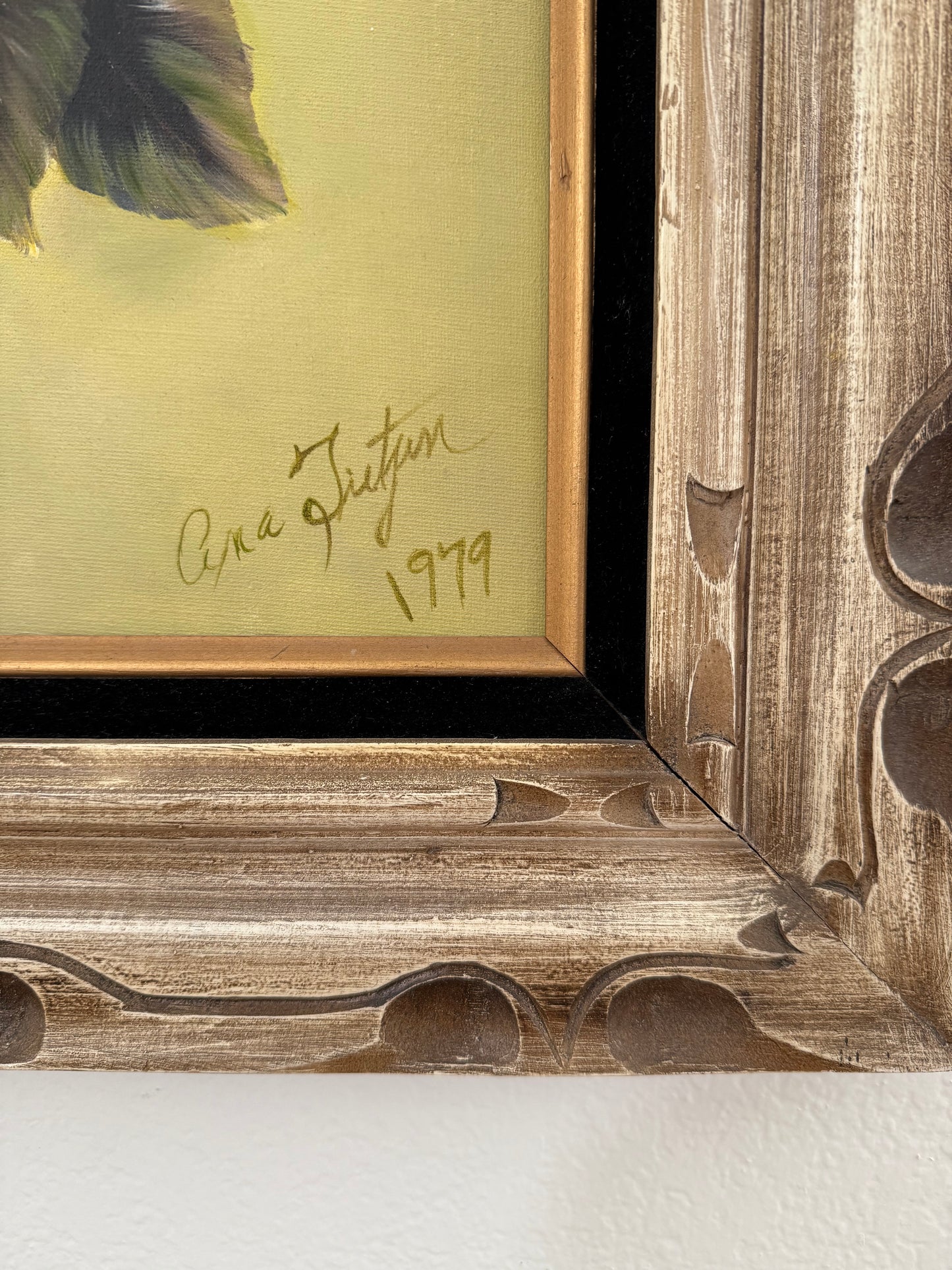 Framed artwork with a signature and date on a light background