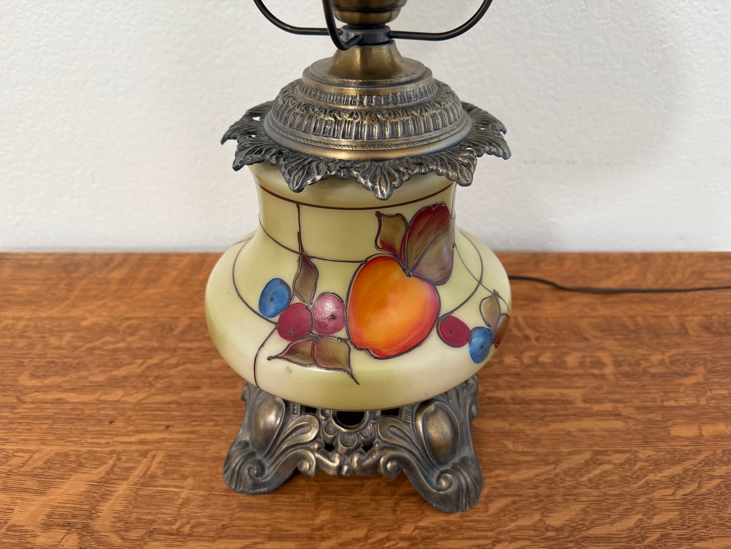 Decorative lamp with fruit design on a wooden surface