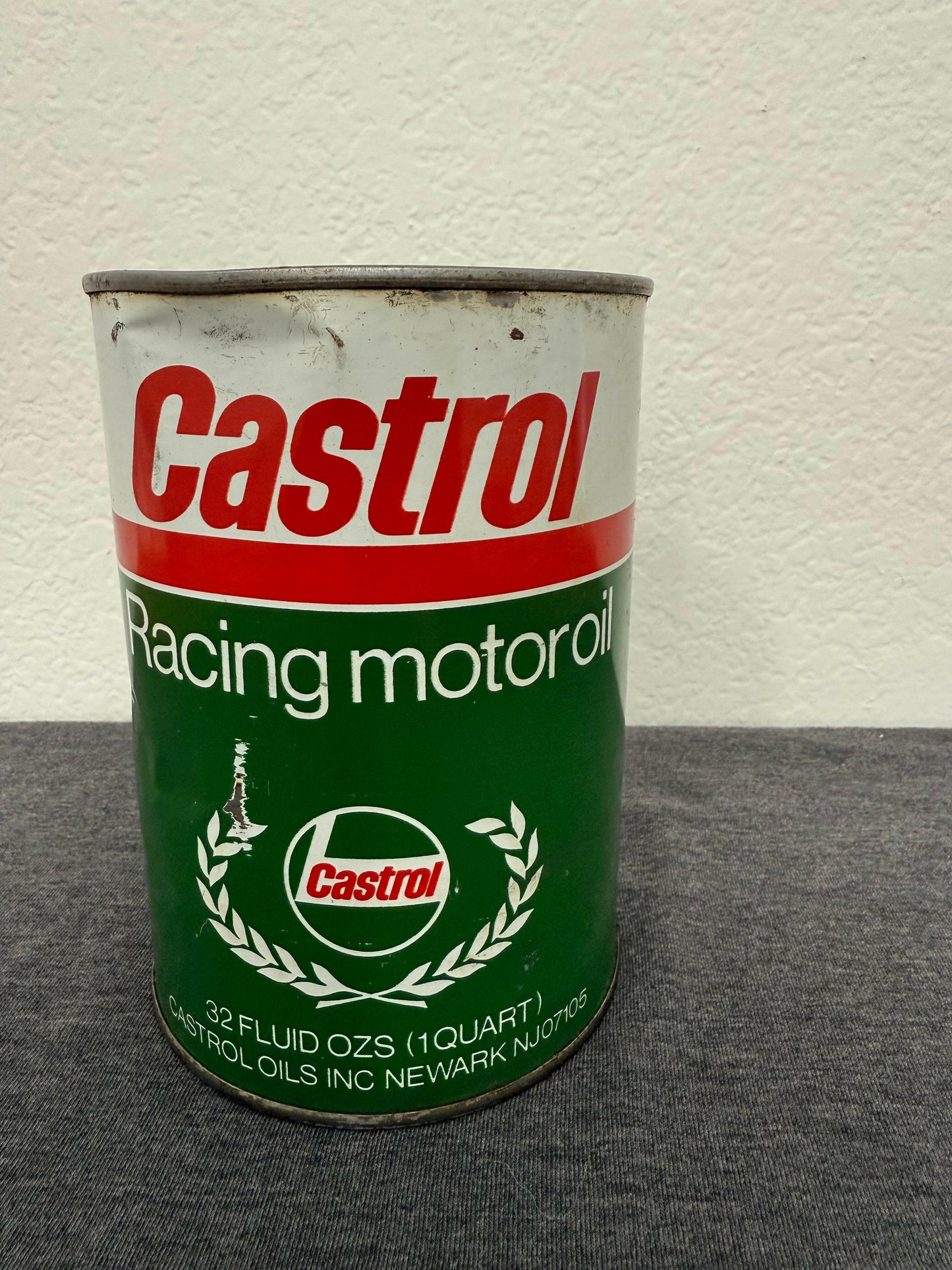 Castrol motor oil can on a gray and white background