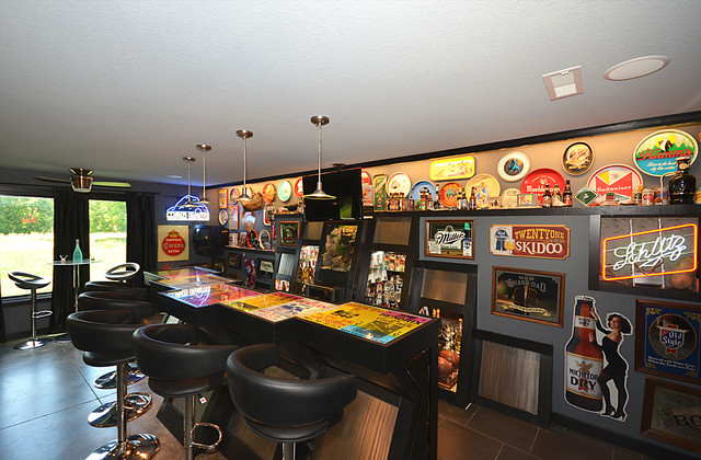 bar seating with vintage advertising on the wall