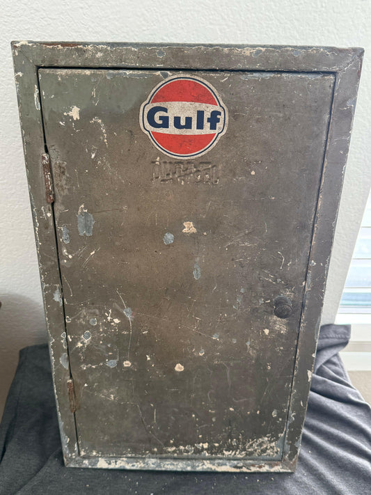 Metal durasteel cabinet with Gulf logo on a white wall