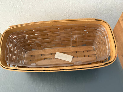 Wicker basket with a clear plastic liner on a gray surface