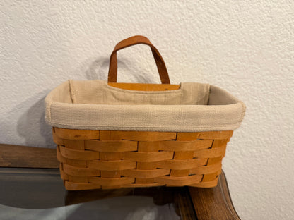Wooden basket with a fabric liner on a white background