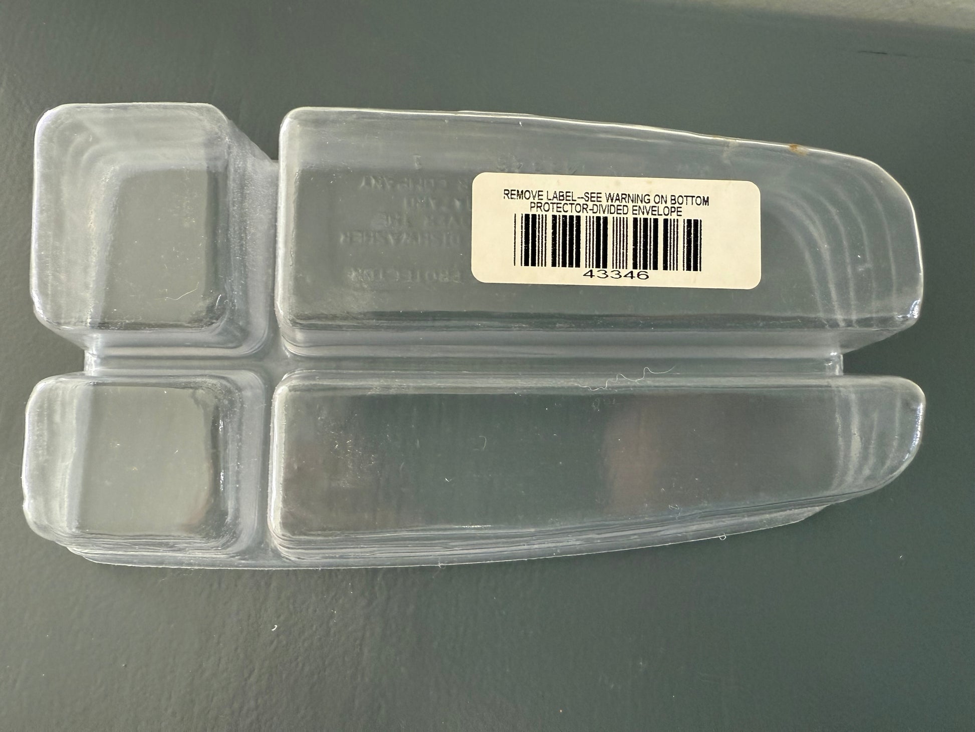 Clear plastic container with a label on a gray background