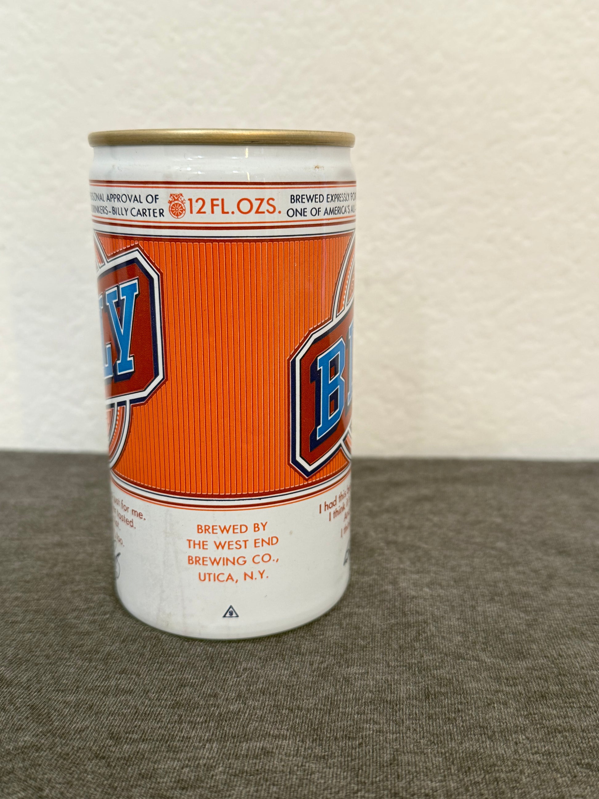 Beer can with a visible brand logo on a textured surface