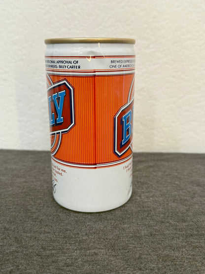 Cylindrical container with orange and white design on a textured surface