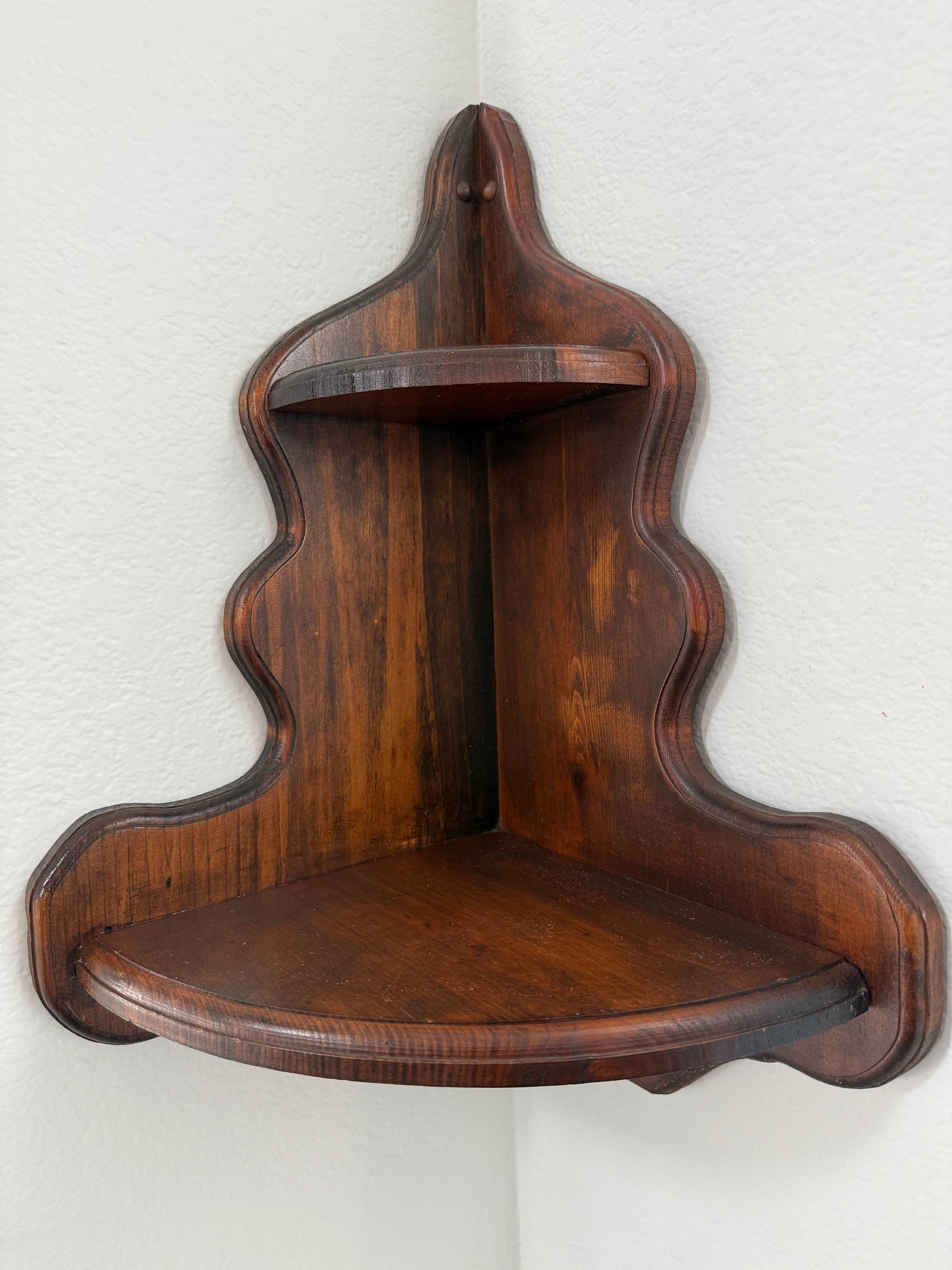 Wooden shelf with wavy edges on a white background