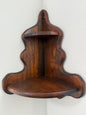 Wooden shelf with wavy edges on a white background