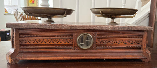 Vintage wooden scale with marble top and decorative details