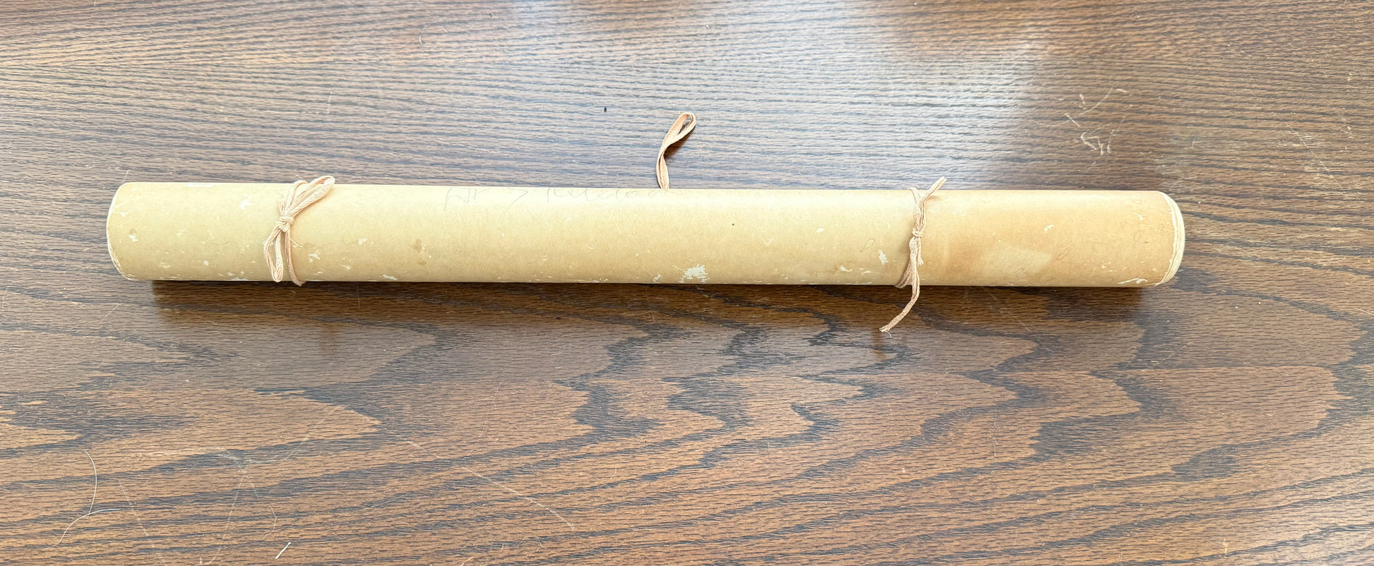 Rolled-up paper on a wooden surface