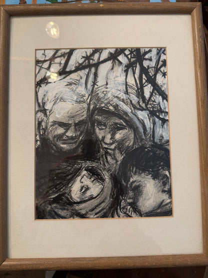 Framed black and white abstract artwork on a textured surface