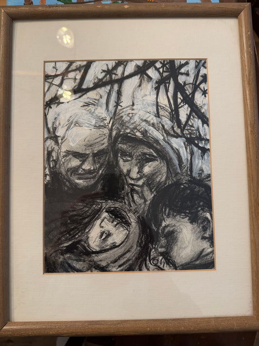 Framed black and white abstract artwork on a textured surface