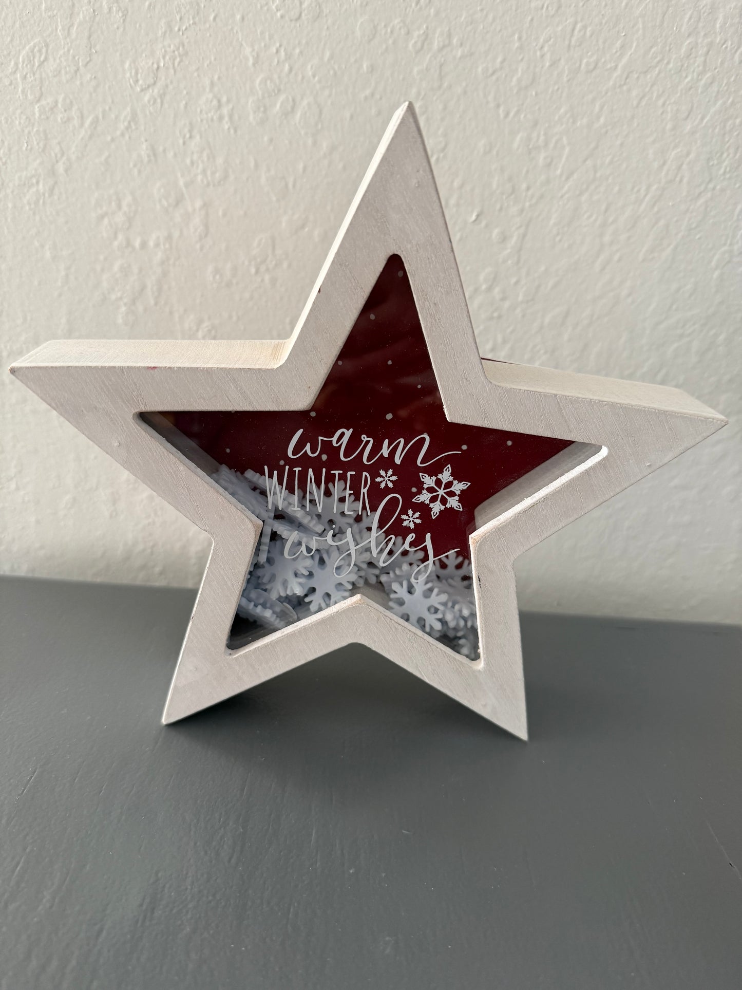 White Star Shaped Sign with Snowflakes and "Warm Winter Wishes" Text