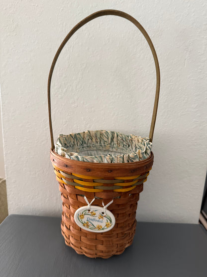 Woven basket with decorative label on a white surface