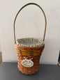 Woven basket with decorative label on a white surface