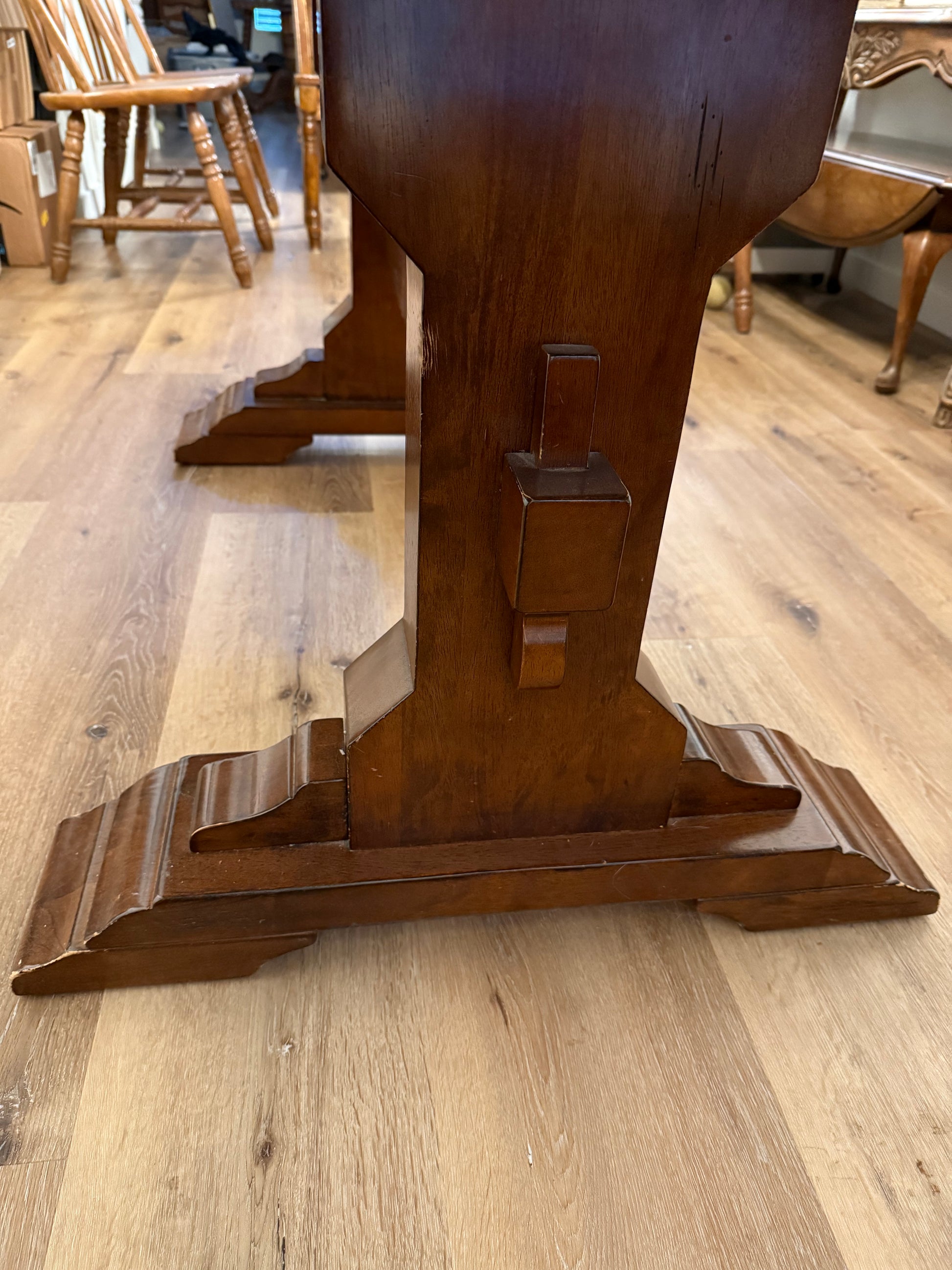 Wooden table legs on a wooden floor