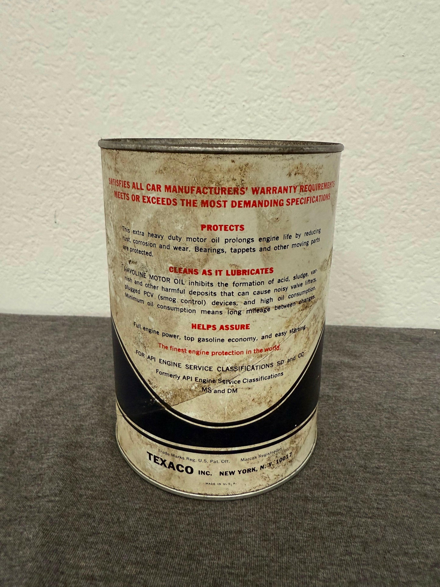 Close-up of a Texaco oil can label on a textured surface