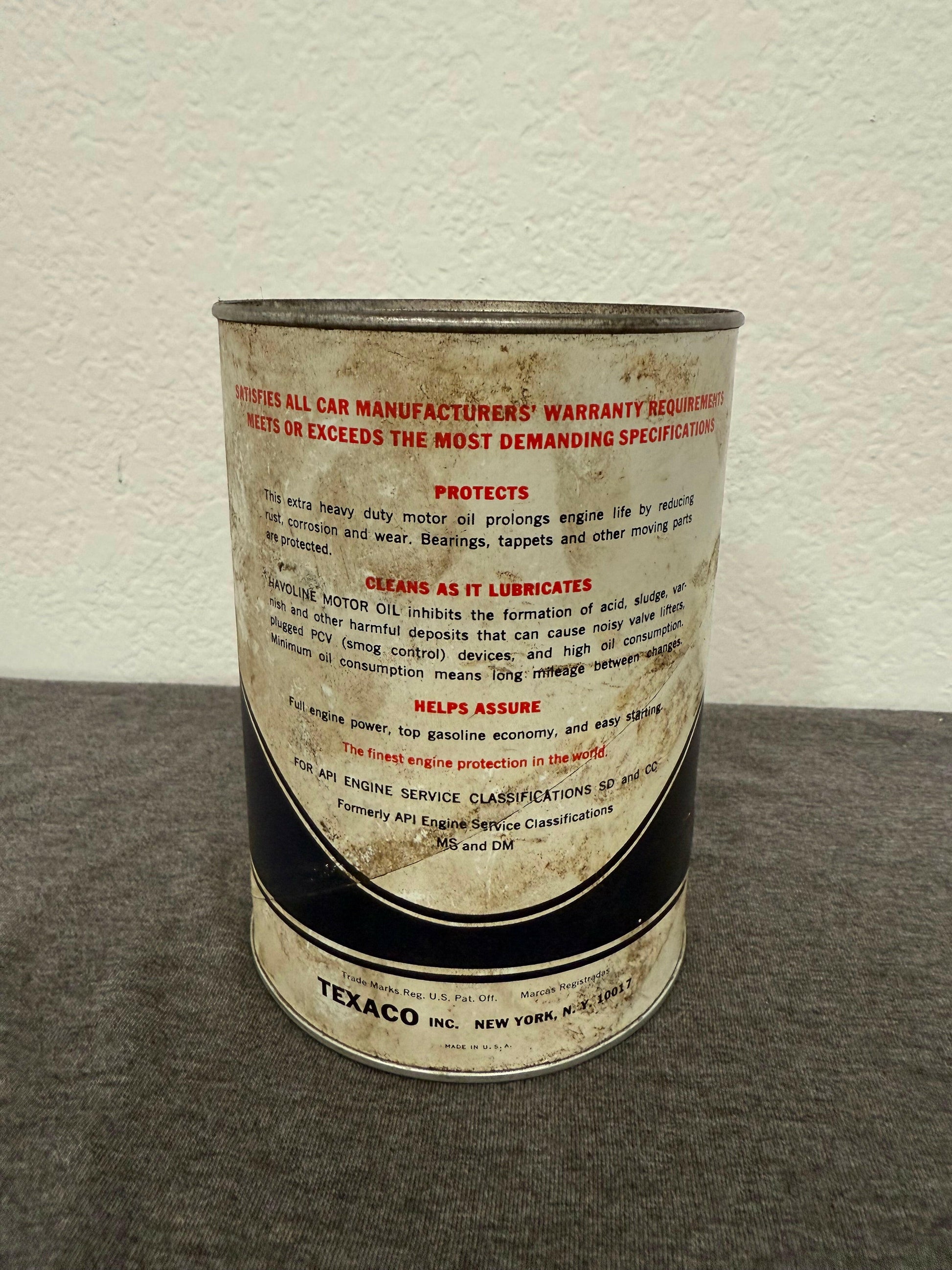 Close-up of a Texaco oil can label on a textured surface