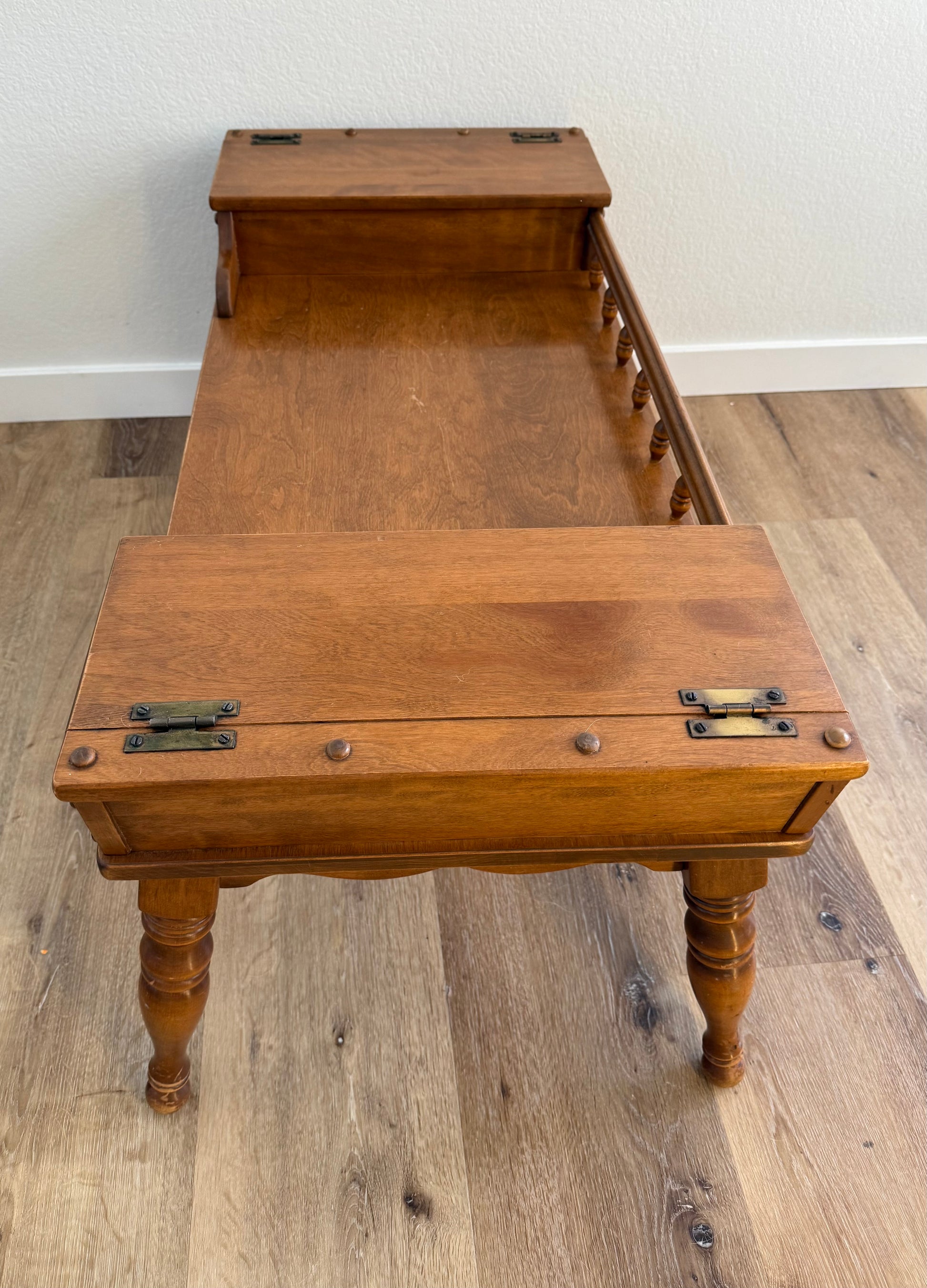 Wooden coffee table with two doors on a wooden floor