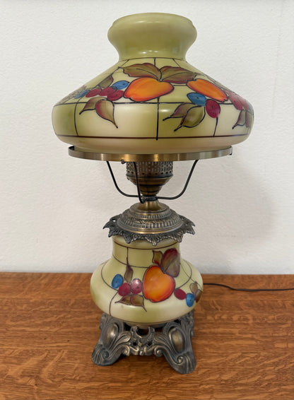 Decorative lamp with fruit design on a wooden surface