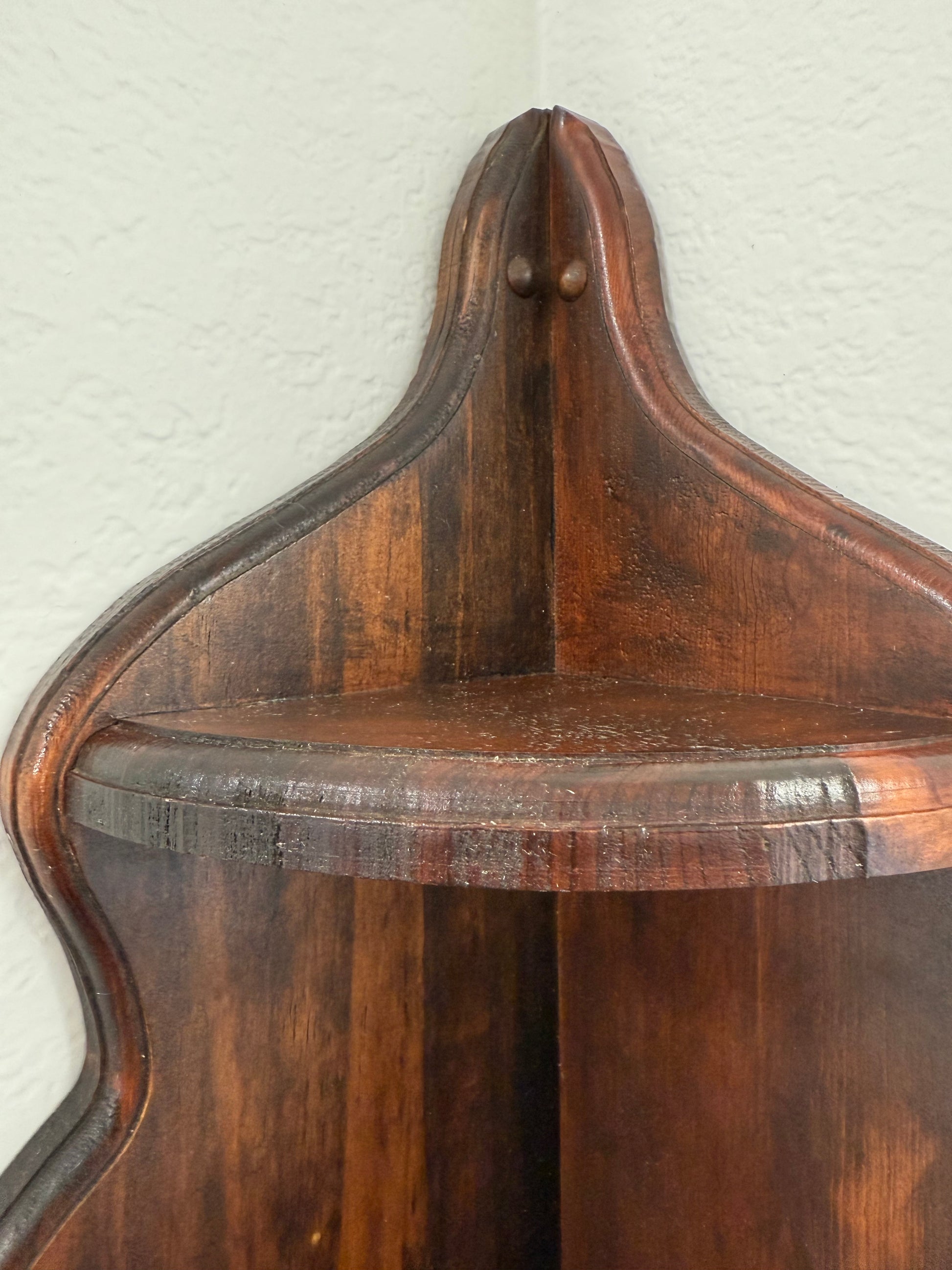 Close-up of a wooden shelf on a white background