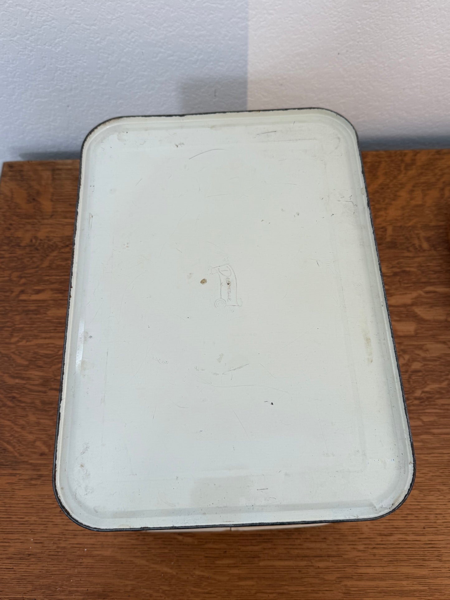 Rectangular metal tin on a wooden surface