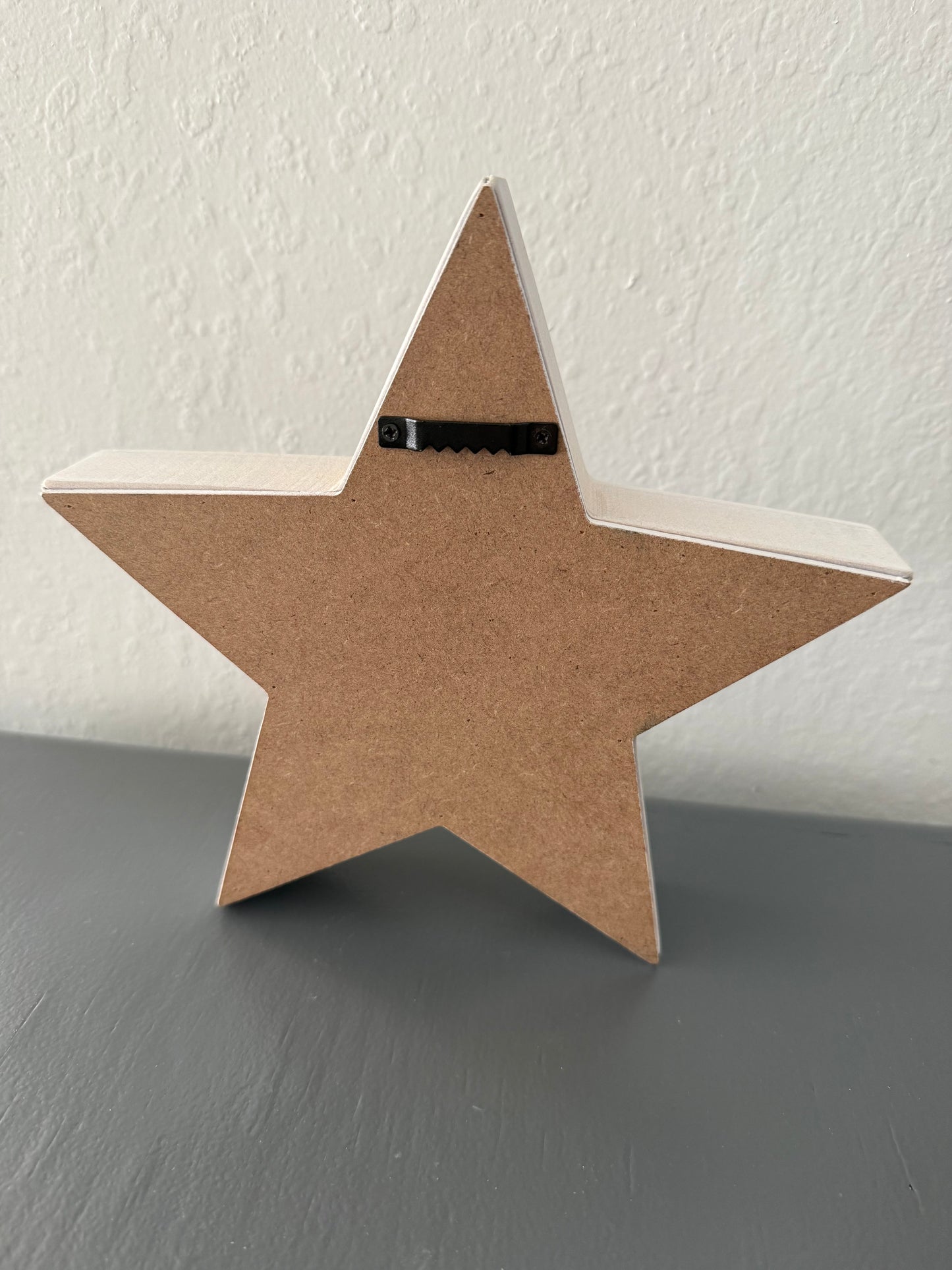 White Star Shaped Sign with Snowflakes and "Warm Winter Wishes" Text