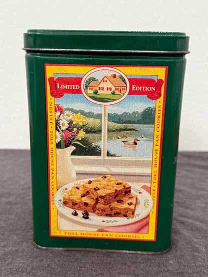 Vintage Nestle Toll House Pan Cookies tin with colorful label on a white background